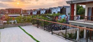 a balcony of a house with bikes on it at FULLMOON CANGGU Nelayan in Canggu