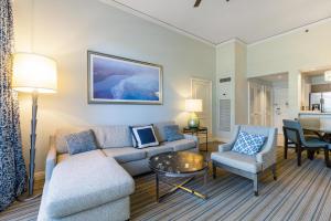 a living room with a couch and a table at Breathtaking 2 Bedroom Condo Placed at Ritz Carlton-Key Biscayne in Miami