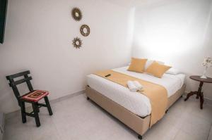 En eller flere senge i et værelse på CASA SANTA CIRCASIA