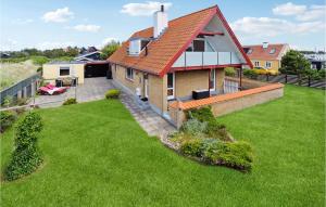 an aerial view of a house with a yard at 3 Bedroom Stunning Home In Skagen in Skagen