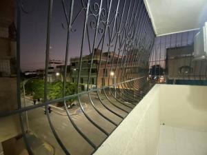 a balcony with a view of a city at night at Aparta estudio en Maicao in Maicao