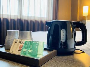 Příslušenství pro přípravu čaje a kávy v ubytování ​Hotel Route-Inn Kumagaya​