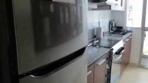 a kitchen with a sink and a counter top at Temporal Apartment in Lima