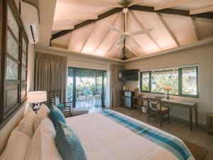 Postel nebo postele na pokoji v ubytování Kaimana Resort Siargao