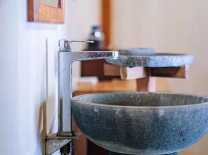 a pair of sinks in a bathroom at Rumah Dharma 2 Riverside in Borobudur +29 photos