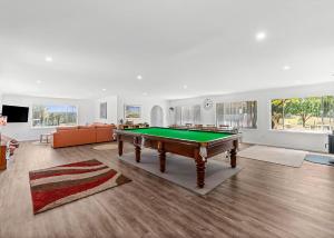 a living room with a pool table in it at Marie's Rest in Tomakin