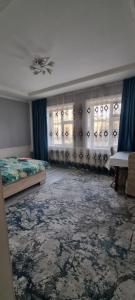 Ένα ή περισσότερα κρεβάτια σε δωμάτιο στο Deluxe