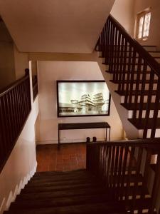 Een TV en/of entertainmentcenter bij Courtyard Pujan Hotel
