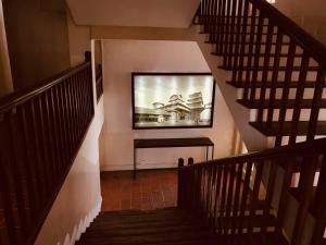 Een TV en/of entertainmentcenter bij Courtyard Pujan Hotel
