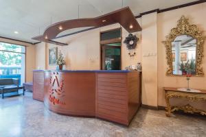a salon with a counter and a mirror at Dequr Hotel Dipati Ukur Mitra RedDoorz in Bandung