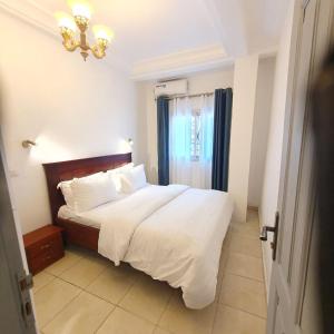 Katil atau katil-katil dalam bilik di Résidence M Douala