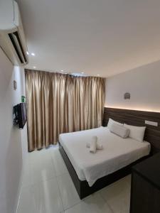 Letto o letti in una camera di One Point Hotel