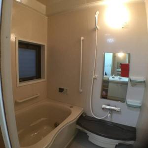 a bathroom with a tub and a toilet and a sink at Cheese Cozy Condo in Tokyo +39 photos
