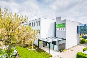 an office building with a sign for the lobby of a hotel at flexymotel Spielberg in Spielberg