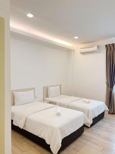 Postel nebo postele na pokoji v ubytování Vvip Hotel