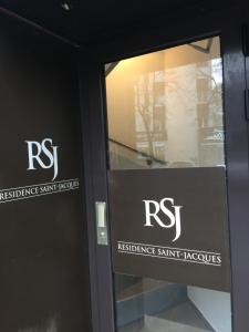 a glass door with a rst sign on it at Studio Place d’Italie/Denfert-Rochereau in Paris