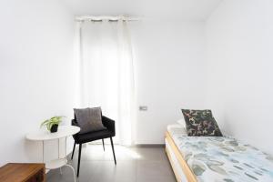 Posteľ alebo postele v izbe v ubytovaní Apartamentos Las Terrazas de Sotavento