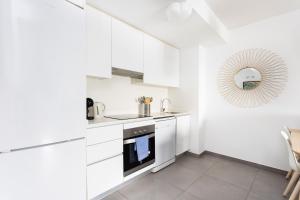 Kuchyňa alebo kuchynka v ubytovaní Apartamentos Las Terrazas de Sotavento
