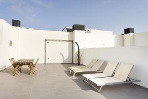 Posedenie v ubytovaní Apartamentos Las Terrazas de Sotavento