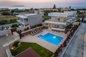 an aerial view of a house with a swimming pool at Villa Sophia-Elpis in Hersonissos