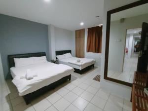 Postel nebo postele na pokoji v ubytování Reintree Lodge Hotel