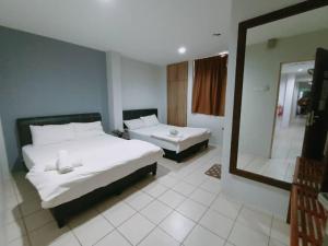 Postel nebo postele na pokoji v ubytování Reintree Lodge Hotel