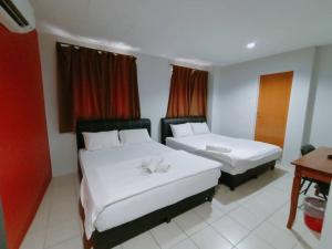 Postel nebo postele na pokoji v ubytování Reintree Lodge Hotel