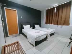 Postel nebo postele na pokoji v ubytování Reintree Lodge Hotel