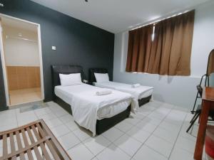 Postel nebo postele na pokoji v ubytování Reintree Lodge Hotel