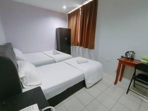 Postel nebo postele na pokoji v ubytování Reintree Lodge Hotel