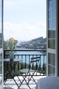 a balcony with a table and a view of the water at Villa San Pietro in Portovenere