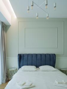Кровать или кровати в номере A Glass Paradise: Exclusive flat at One Floreasca