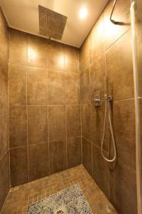 a bathroom with a shower stall with a shower at Owner Suite in Mons