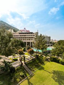 a large building with a park in front of it at Kaya Izmir Thermal & Convention in Izmir