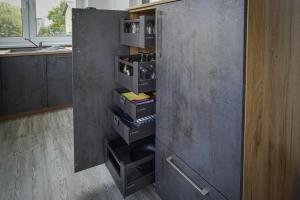 a kitchen with a cabinet with drawers in it at Ferienwohnung Weitblick in Naumburg