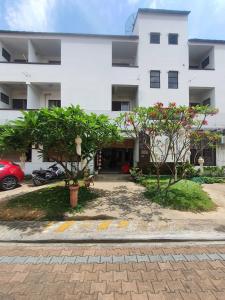 a white building with trees in front of it at Mali's Room in Chiang Mai +36 photos