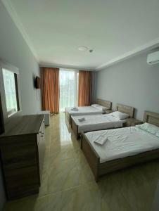 Postel nebo postele na pokoji v ubytování Hotel Mia