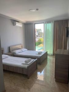 Postel nebo postele na pokoji v ubytování Hotel Mia