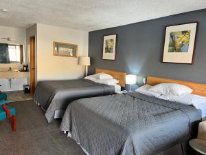 Postel nebo postele na pokoji v ubytování BIGGS NU-VU MOTEL