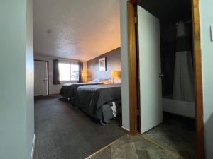 Postel nebo postele na pokoji v ubytování BIGGS NU-VU MOTEL