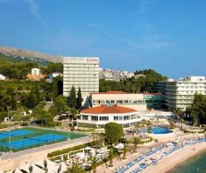a view of a resort with a beach and buildings at DELUX 2 bedrooms Apartment near SPLIT - GOGA in Žrnovnica