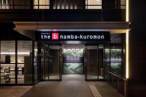 a building with a sign that reads the b manila korman at the b namba-kuromon in Osaka