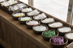 a group of baskets of toothbrushes on a counter at the b namba-kuromon in Osaka