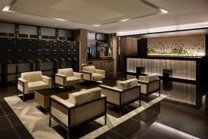 a bar with chairs and tables in a room at the b namba-kuromon in Osaka