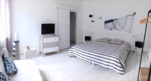 Łóżko lub łóżka w pokoju w obiekcie Gîte Escale en vue - 3 Chambres - 150 m de la plage -