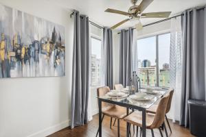 a dining room with a table and chairs and a window at 2 Day Minimum - Spacious 1 Bedroom close to Beach in Long Beach