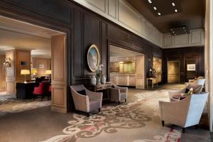 a lobby with chairs and a desk and a salon at The Westin Paris - Vendôme in Paris