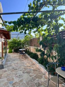 A garden outside KONTIS' Luxury Detached house near the sea