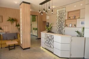 a lobby of a house with a reception desk at Hotel Forum City in Pazardzhik