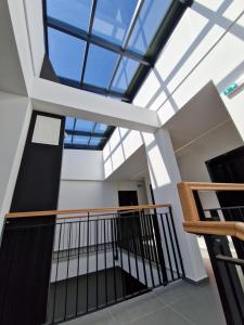 a skylight in the ceiling of a building at Smart Loft Apartment in Tuzla